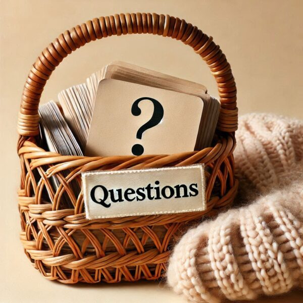 AI-generate image - Frequently Asked Questions - Wicker basket with cards and a question mark on the top card. The basket has a label that reads "Questions." To the right, a knitted garment.